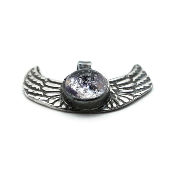 angel wings cremation jewelry front angled view with purple glass