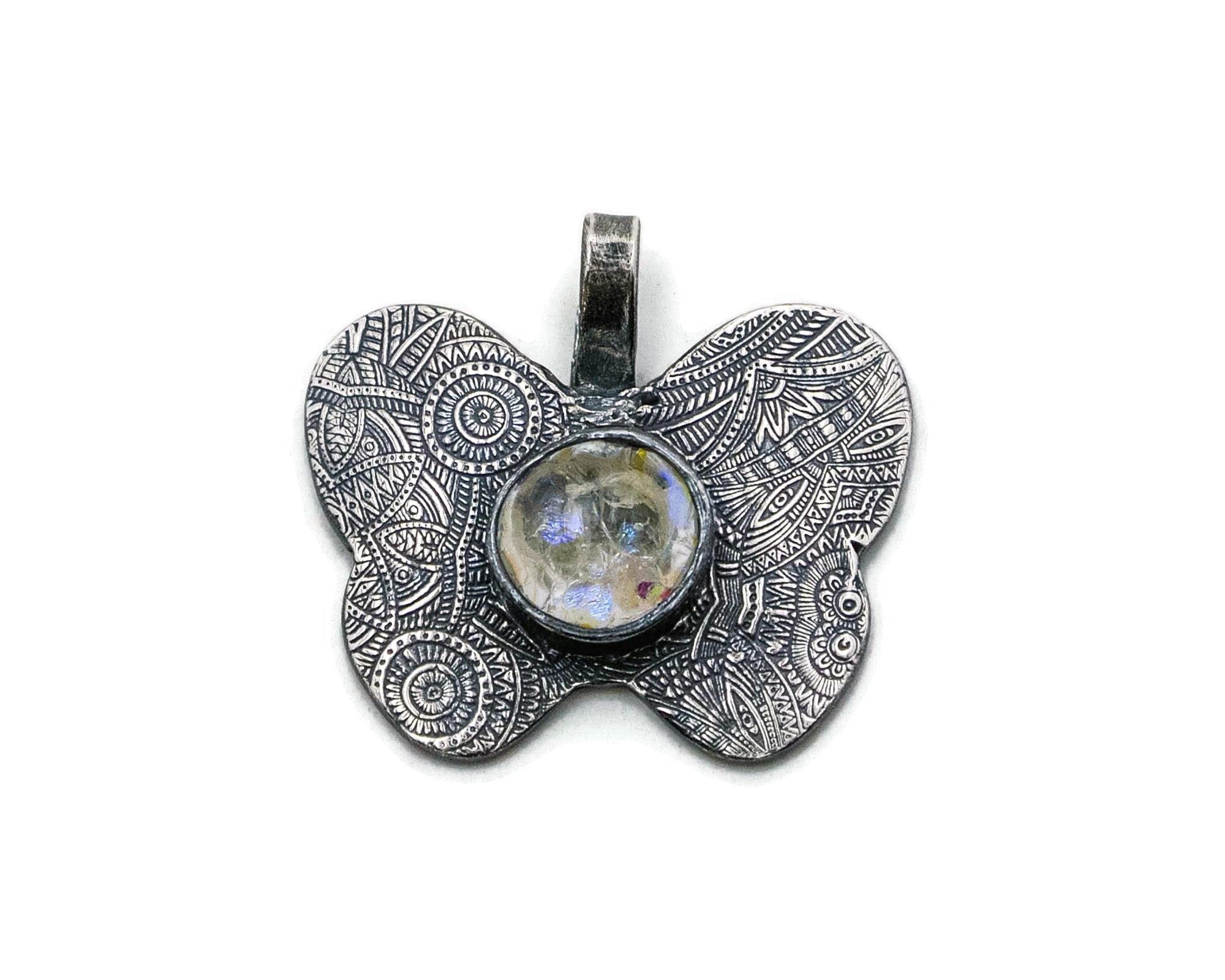 Top view of silver butterfly pendant with custom personalized inspirational words and custom glass colors