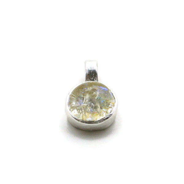 front angle of dainty round cremation ash in glass pendant