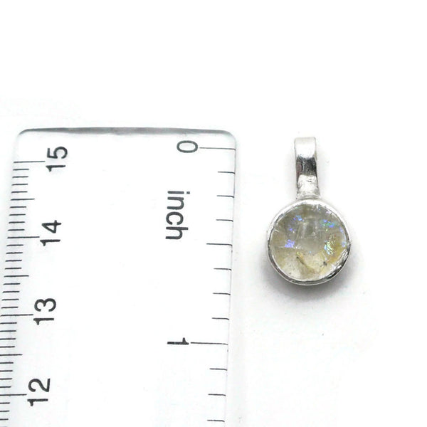 small round silver cremation glass with ruler